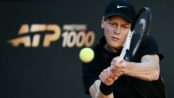 Italy's Jannik Sinner hits a return to Norway's Casper Ruud during the men's final of the ATP Rome Open tennis tournament at Foro Italico in Rome on May 17, 2026.
