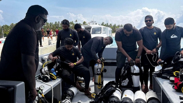 A recovery team prepare to search for missing divers in the Maldives