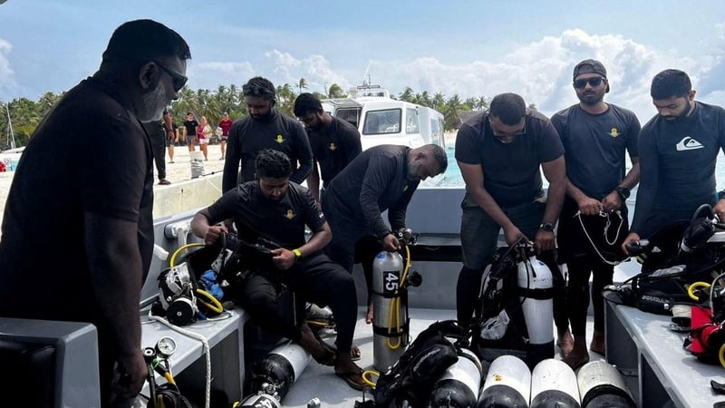 A recovery team prepare to search for missing divers in the Maldives