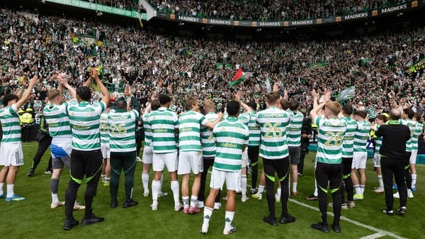 The Celtic players celebrate with their fans at full time during a William Hill Premiership match between Celtic and Heart of Midlothian at Celtic Park, on May 16, 2026, in Glasgow, Scotland.