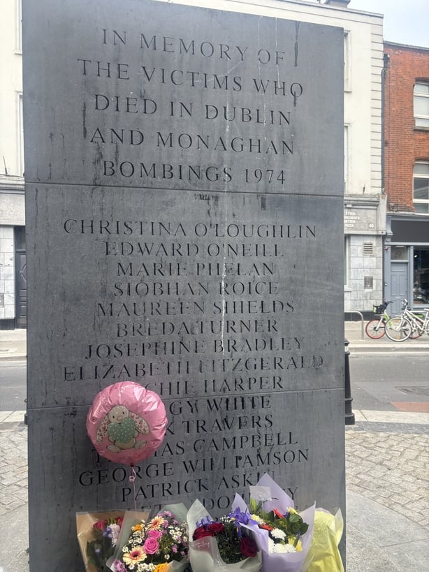 Flowers laid in front of Dublin Monaghan bombing commemoration stone