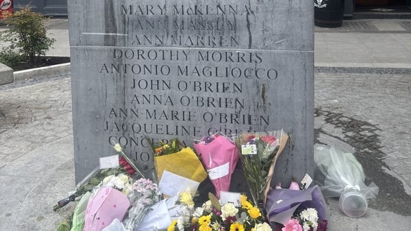 Flowers laid in front of Dublin Monaghan bombing commemoration stone
