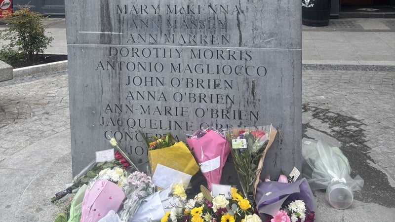 Flowers laid in front of Dublin Monaghan bombing commemoration stone