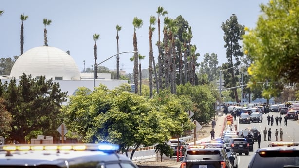 Police vehicles close to the Islamic Center of San Diego after a shooting killed several people