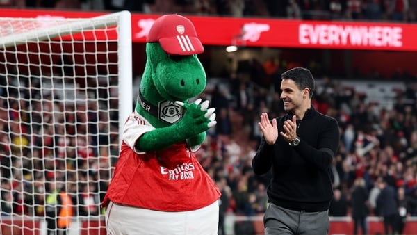 LONDON, ENGLAND - MAY 18: Gunnersaurus, Mascot of Arsenal, and Mikel Arteta, Manager of Arsenal, applaud the fans after the team's victory in the Premier League match between Arsenal and Burnley at Emirates Stadium on May 18, 2026 in London, England. (Pho