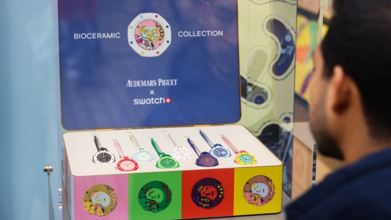 A box of once-off colourful watches in a shop window