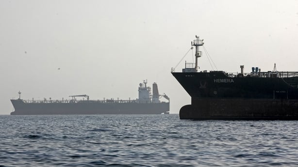 A ship remains anchored in the Strait of Hormuz