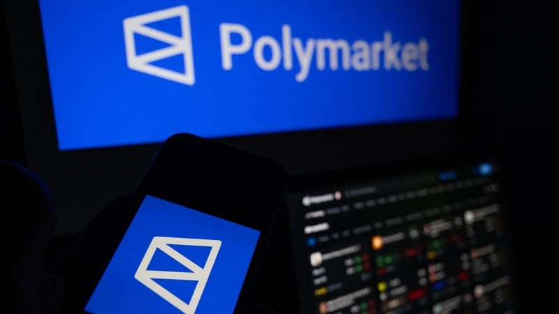 This photograph shows set up screens displaying the logo and home page of US cryptocurrency based prediction market platform Polymarket, in Saint-Mande, east of Paris, on April 29, 2026. (Photo by Martin LELIEVRE / AFP)