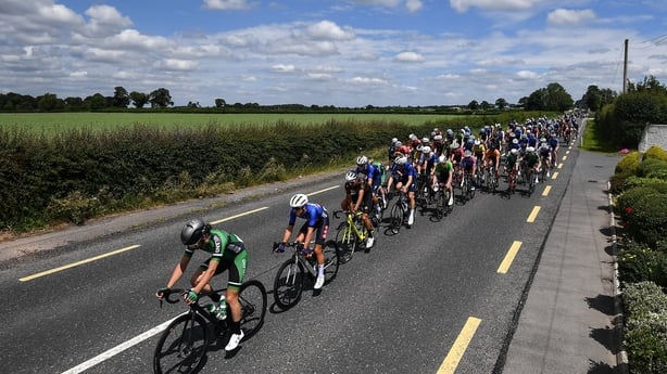 15 June 2022; The peloton led by Adam Ward of Team Ireland makes it way along the Dublin Road to Athy during Stage 1 of the Rás Tailteann 2022 at Horse and Jockey in Parkstown, Tipperary. Photo by David Fitzgerald/Sportsfile