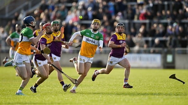 16 May 2026; Daniel Bourke of Offaly hand passes to team mate Shane Rigney during the Leinster GAA Senior Hurling Championship Round 4 match between Offaly and Wexford at Glenisk O'Connor Park in Tullamore, Offaly. Photo by Tom Beary/Sportsfile
