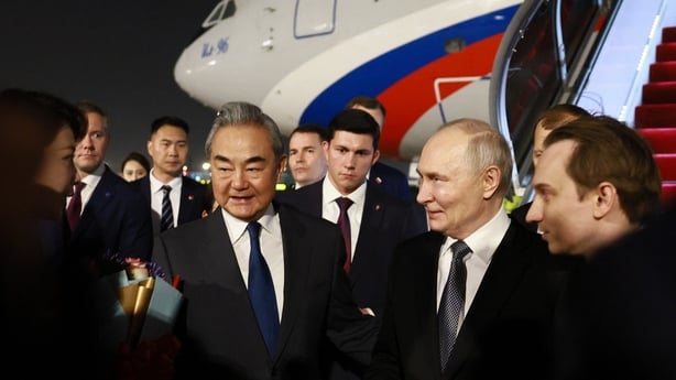 Russia's President Vladimir Putin welcomed by Chinese Foreign Minister Wang Yi and other officials upon his arrival at Beijing Capital Airport in Beijing.