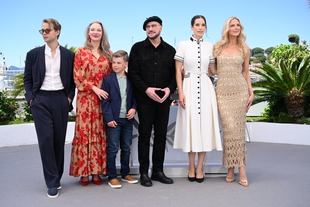 CANNES, FRANCE - MAY 16: Edouard Philipponnat, Kelly B. Eviston, Clark Shotwell, John Travolta, Ella Bleu Travolta and Olga Hoffmann pose during the "Propeller One-Way Night Coach" photocall at the 79th annual Cannes Film Festival at Palais des Festivals on May 16, 2026 in Cannes, France. (Photo by 