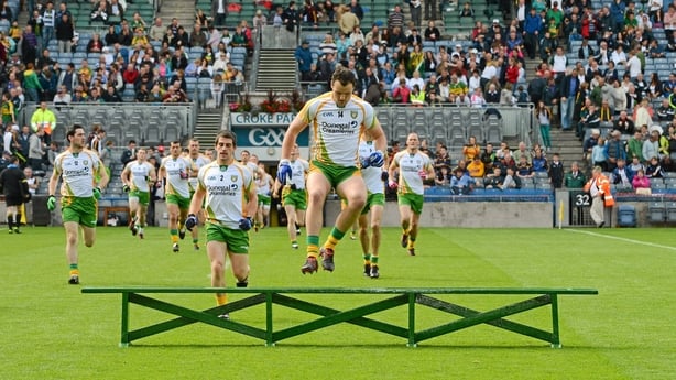 5 August 2012; The Donegal squad, lead by their captain Michael Murphy, make their way to the bench for the traditional team photograph. GAA Football All-Ireland Senior Championship Quarter-Final, Donegal v Kerry, Croke Park, Dublin. Picture credit: Ray McManus / SPORTSFILE