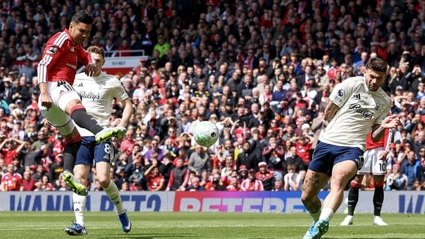 MANCHESTER, ENGLAND - MAY 17: Manchester United's Casemiro volleys a shot at goal despite the attentions of Nottingham Forest's Morato during the Premier League match between Manchester United and Nottingham Forest at Old Trafford on May 17, 2026 in Manchester, United Kingdom. (Photo by Lee Parker -