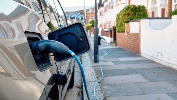 An electric car being charged on a street in London