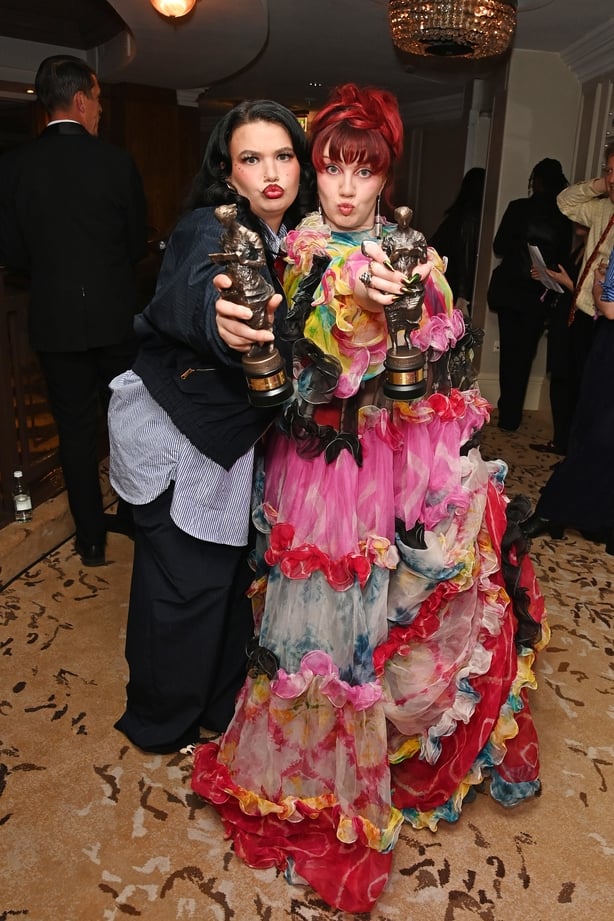 Lola Young, winner of the PRS for Music Most Performed Work, and CMAT, winner of the Best Album award, attend The 71st Ivor Novello Awards 2026 at The JW Marriott Grosvenor House Hotel on 21 May, 2026 in London. (Photo by Alan Chapman/Dave Benett/Getty Images for The Ivors)