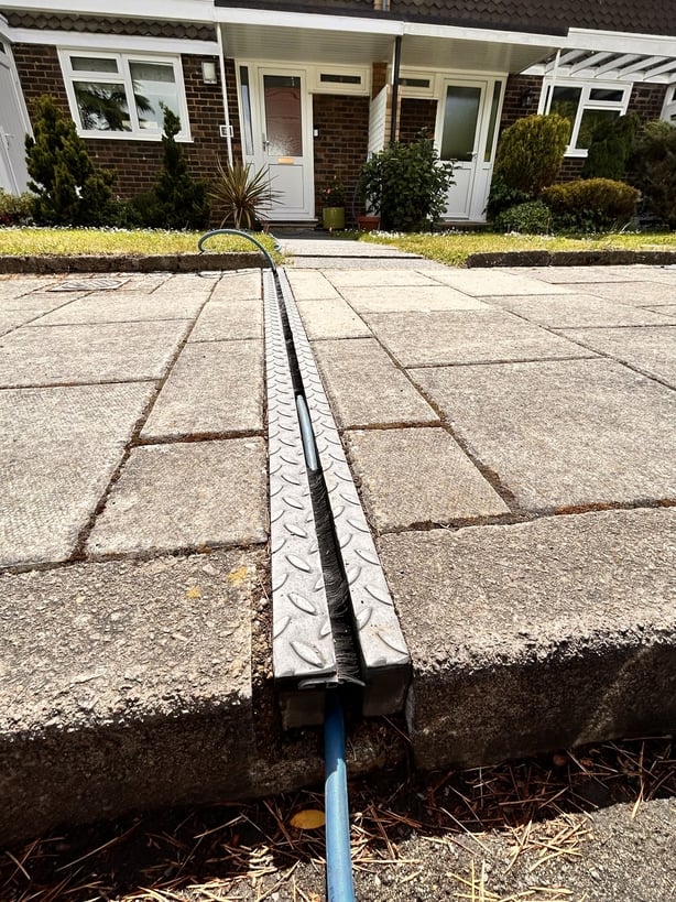 a channel which holds a ev charger cable 