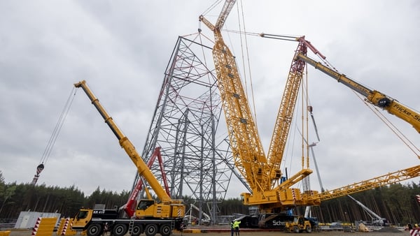 Workers put together what will become the world's tallest wind turbine in Schipkau, eastern Germany