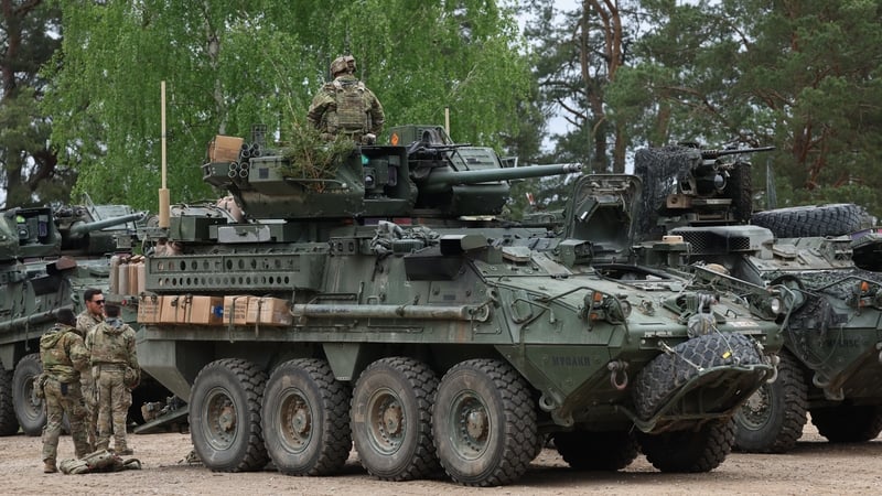 Soldiers of the U.S. Army 2nd Cavalry Regiment Stryker Brigade prepare to head out with their vehicles during a live fire day of the Amber Shock 26 portion of the Saber Strike 26 NATO military exercises