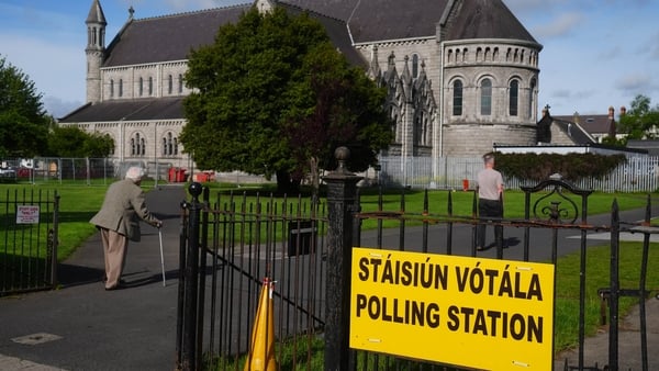 Voters at the polling station at St Columba's National School in Glasnevin, Dublin
