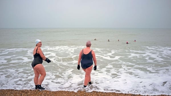 Swimmers taking a dip at the sea (Alamy/PA)