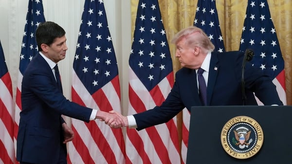 WASHINGTON, DC - MAY 22: U.S. President Donald Trump shakes hands with Kevin Warsh (L) as they arrive to Warsh's swearing-in ceremony to be the new Chairman of the Federal Reserve in the East Room of the White House on May 22, 2026 in Washington, DC. Wars