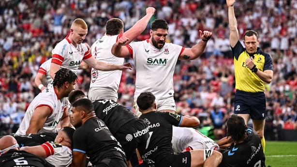 22 May 2026; Tom O'Toole of Ulster, centre, celebrates his side's first try, scored by teammate Nick Timoney, hidden, during the 2026 EPCR Challenge Cup final match between Montpellier Hérault Rugby and Ulster at San Mamés Stadium in Bilbao, Spain. Photo by Seb Daly/Sportsfile