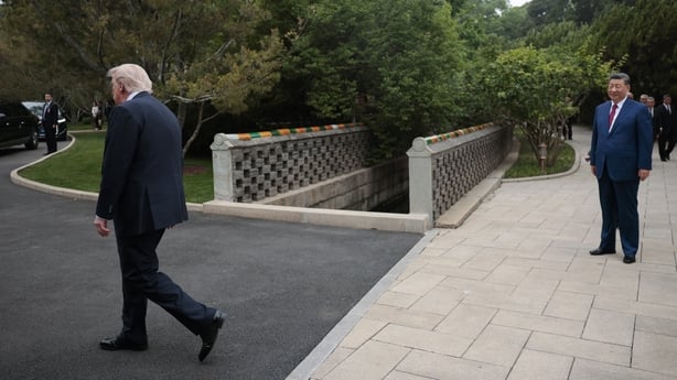 US President Donald Trump (L) walks towards his car as China's President Xi Jinping (R) watches following a visit to Zhongnanhai Garden in Beijing on May 15, 2026. (Photo by Evan Vucci / POOL / AFP)