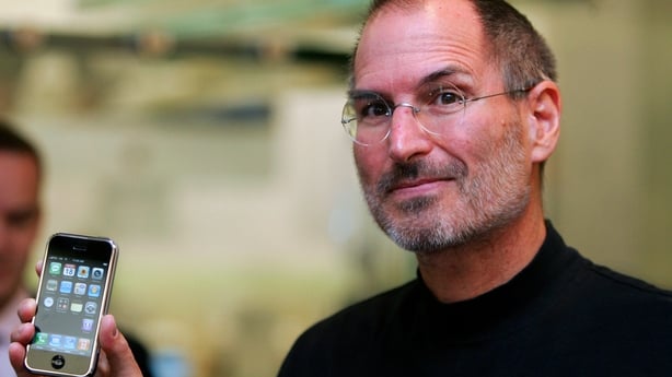 Steve Jobs, chief executive officer of Apple Corp., holds an iPhone as he attends the event to mark Apple choosing O2 as exclusive carrier for iPhone in the UK at the Apple store in Regents Street, London, U.K., Tuesday, Sept. 18, 2007. Apple Inc. will sell the iPhone inthe U.K. with mobile-service