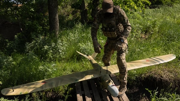 Members of the Lava Unmanned Systems Regiment assemble a drone as they wait for a combat mission in the Kharkiv region, Ukraine.