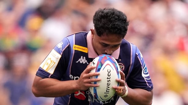 BILBAO, SPAIN - MAY 23: Yoram Moefana of Union Bordeaux Begles kisses the ball as he celebrates scoring his team's fifth try during the Investec Champions Cup Final match between Leinster Rugby and Union Bordeaux Begles at San Mames Stadium on May 23, 2026 in Bilbao, Spain. (Photo by Juan Manuel Ser