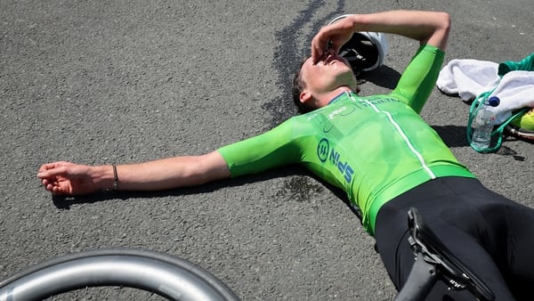 Conn McDunphy of the APS Pro Cycling team shows the efforts of the day after claiming the Race leaders Kia Yellow jersey at the stage end. Photo : Lorraine O'Sullivan
