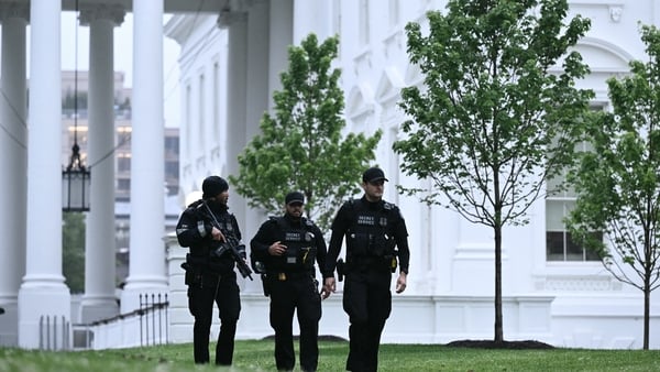 Secret Service agents are seen after a lockdown was lifted at the White House