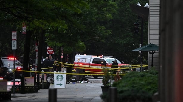 Police tape blocks off a sidewalk next to emergency and police vehicles near the White House in Washington