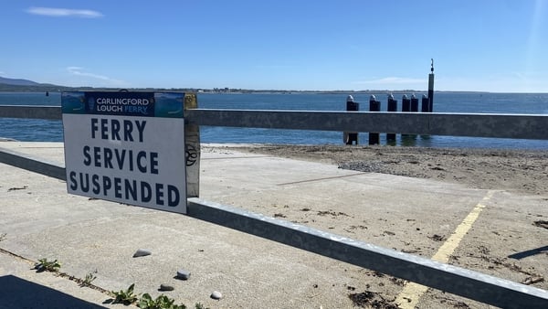 A sign says Carlingford Lough ferry service is suspended