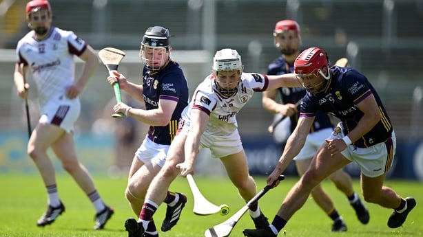 Joshua Ryan of Galway is tackled by Seán Linnane, left, and Gavin Lee of Galway during the Leinster GAA Senior Hurling Championship Round 5 match between Wexford and Galway at Chadwicks Wexford Park in Wexford. 