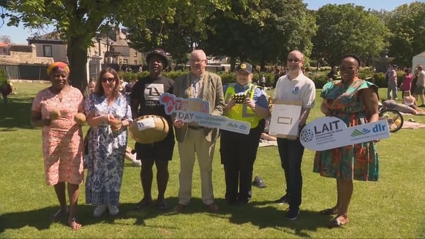 People gather with an Africa Day sign.