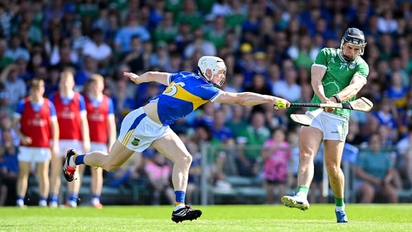 Aidan O’Connor of Limerick shoots to score his side's fourth goal despite the attention of Bryan O'Mara of Tipperary during the Munster GAA Senior Hurling Championship Round 5 match between Limerick and Tipperary at TUS Gaelic Grounds in Limerick.