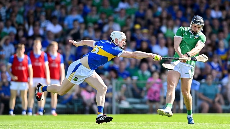Aidan O’Connor of Limerick shoots to score his side's fourth goal despite the attention of Bryan O'Mara of Tipperary during the Munster GAA Senior Hurling Championship Round 5 match between Limerick and Tipperary at TUS Gaelic Grounds in Limerick.