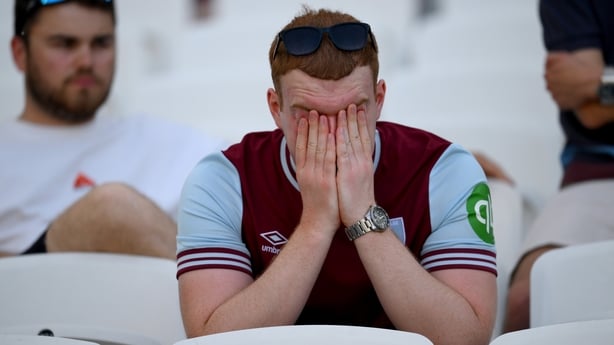 A fan of West Ham United looks dejected after the Premier League match between West Ham United and Leeds United at the London Stadium on May 24, 2026 in London, England. 