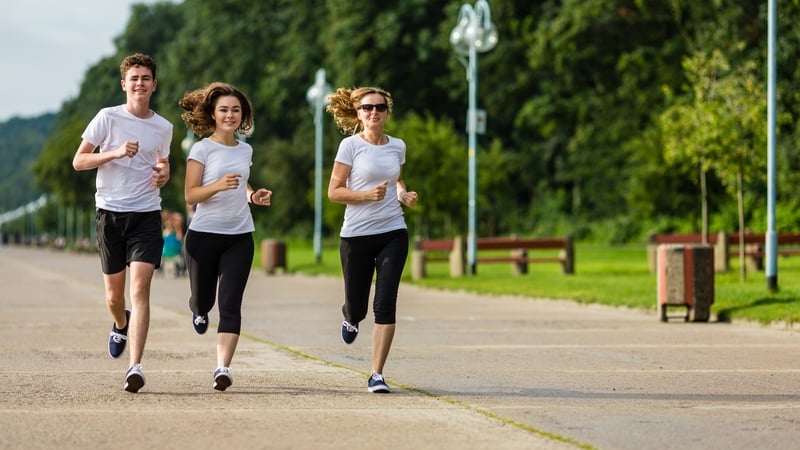 teenagers running city park