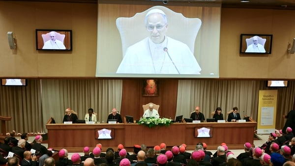 People are gathered as Pope Leo XIV attends the presentation of his first Encyclical Letter