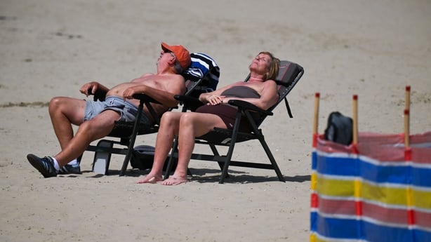 WEYMOUTH, ENGLAND - MAY 21: Visitors enjoy the hot weather on Weymouth beach, on May 21, 2026 in Weymouth, England. An exceptional bank holiday heatwave is currently bringing record-breaking weather to England with temperatures forecast to climb into the low 30s by Monday. The intense high pressure 