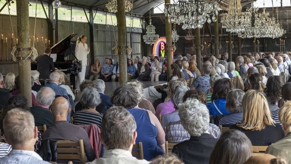 Guests look at a performance as part of the Blackwater Valley Opera Festival