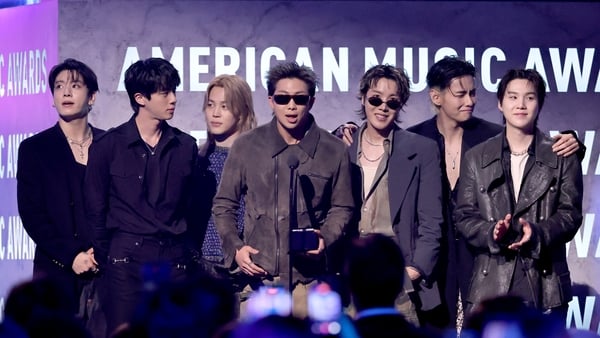 LAS VEGAS, NEVADA - MAY 25: (EDITORIAL USE ONLY) (L-R) Jungkook, Jin, Jimin, RM, J-Hope, V and Suga of BTS accept the Artist of the Year award onstage during the 52nd American Music Awards at MGM Grand Garden Arena on May 25, 2026 in Las Vegas, Nevada. (P