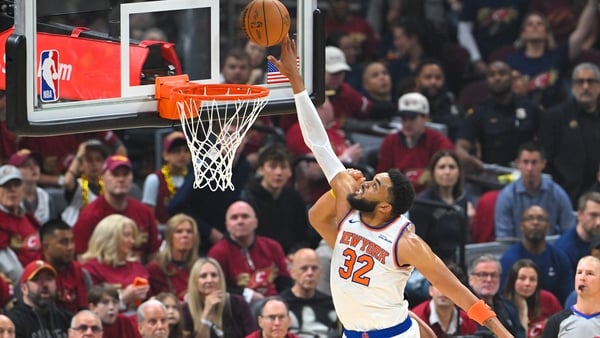 Karl-Anthony Towns #32 of the New York Knicks gets called for goal tending against Jarrett Allen #31 of the Cleveland Cavaliers during the first period in Game Three of the NBA Eastern Conference Finals at Rocket Arena on May 23, 2026 in Cleveland, Ohio.