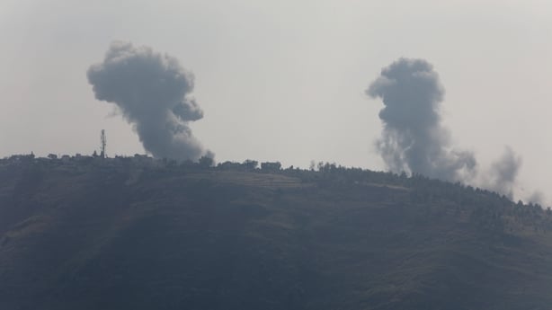 Smoke trails are pictured from the Israeli missile strike that targeted the village of Nabatieh
