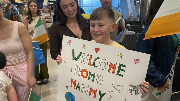Ten year old Jack Heavy waiting for the return of his mother Battalion Quartermaster Sergeant (BQMS) Paula Quinn, returning from her sixth mission