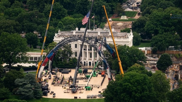 Workers construct a UFC fighting ring ahead of a planned Ultimate Fighting Championship (UFC) fight on the South Lawn of the White House in Washington, DC, US, on Tuesday, May 26, 2026. UFC is planning to host a cage match at the White House on June 14. P