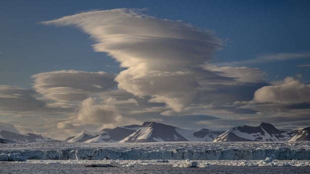 Lenticular clouds appear over the glaciers near Svalbard 